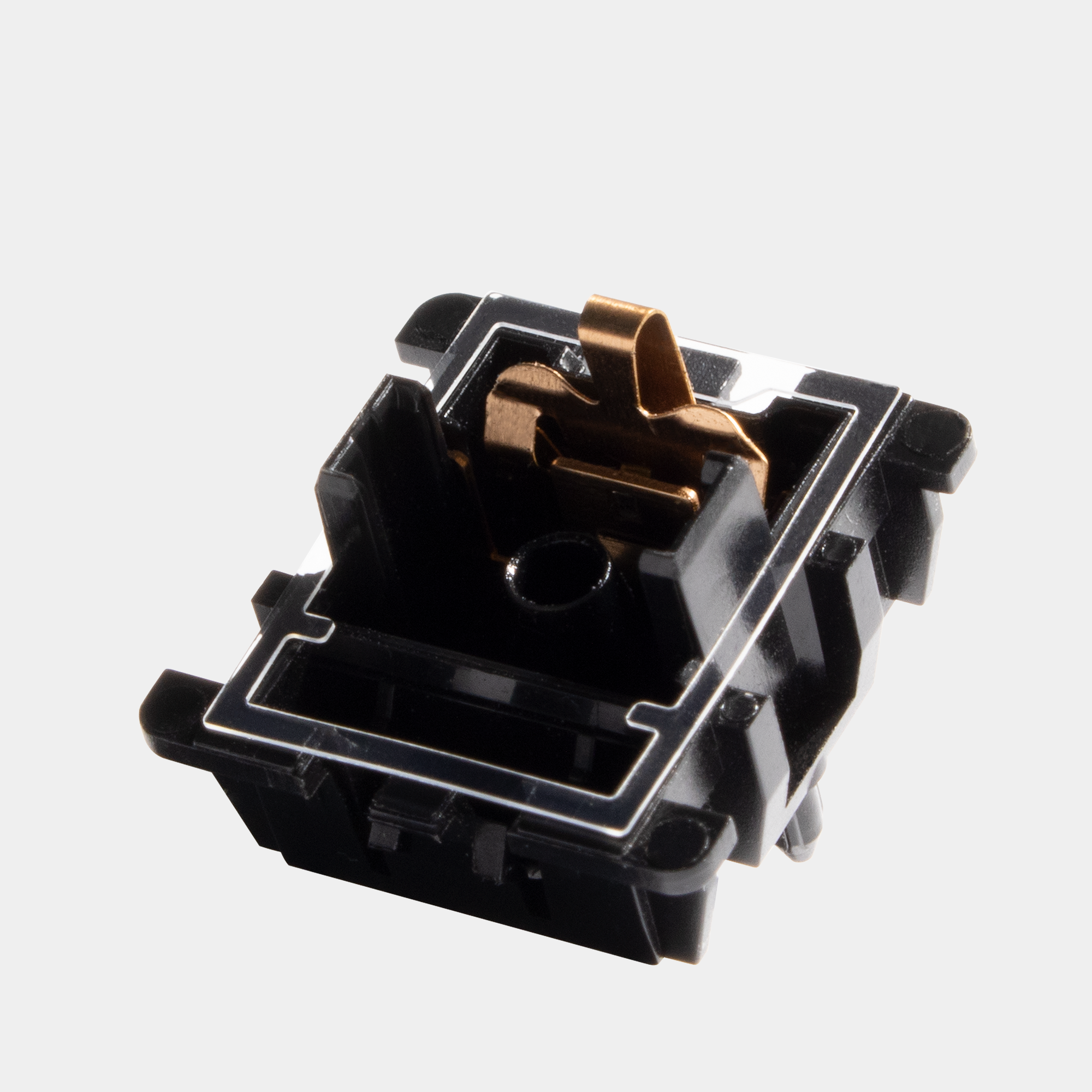 A single clear TX Film sitting on top of a black bottom housing.